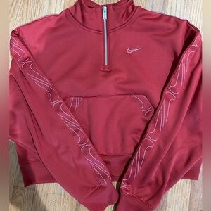 Nike cropped therma fit pull over. Size small. The color is a burnt orange.